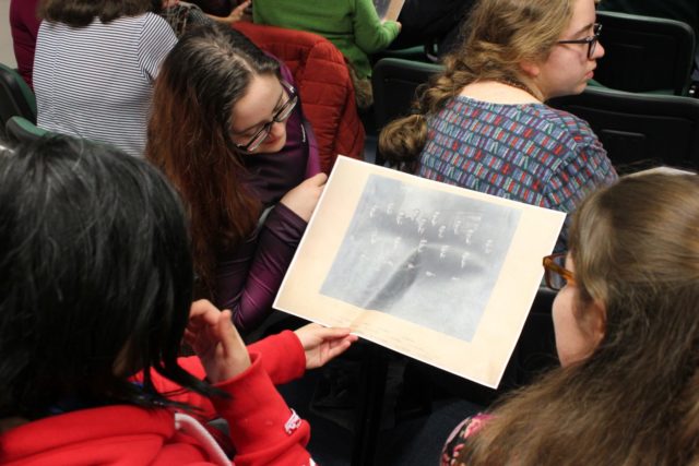 Richard Taunton students take a look at some photos of Alumni from the early 1900s