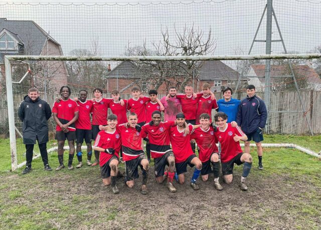 Sports teacher Luke Roberts, second right, and fellow coach Andy Powell, left, with the triumphant Richard Taunton team after they clinched the Hampshire Colleges League Two title