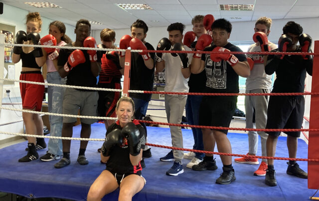Pictured: Psychology teacher Paula Buckmaster with some of her students in a boxing enrichment session in the gym at Richard Taunton Sixth Form College
